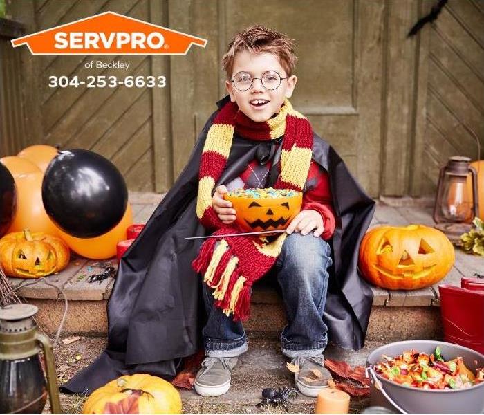 A kid dressed up as Harry Potter's character enjoys Halloween treats.