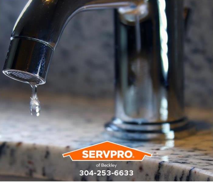 A faucet is allowed to drip water to prevent frozen pipes.